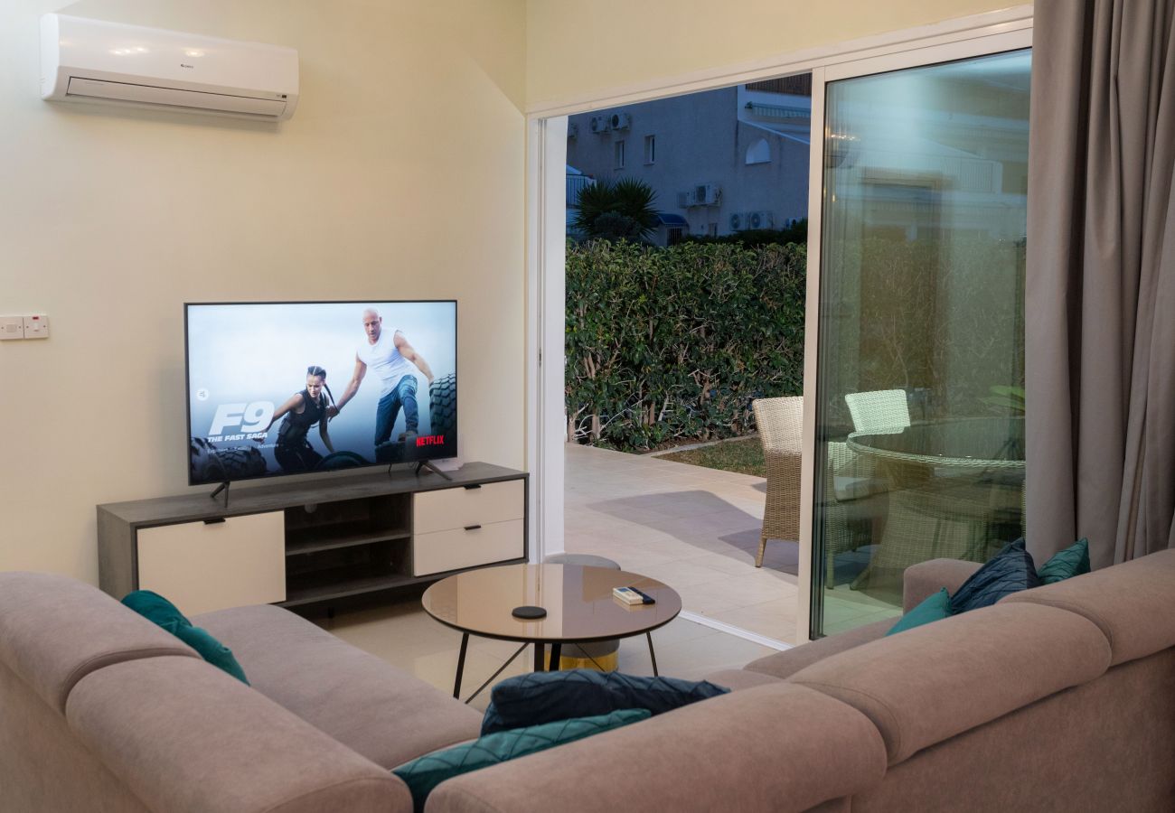 Living room with Large TV  & Streaming Facilities, Patio Doors leading to the Garden Terrace.